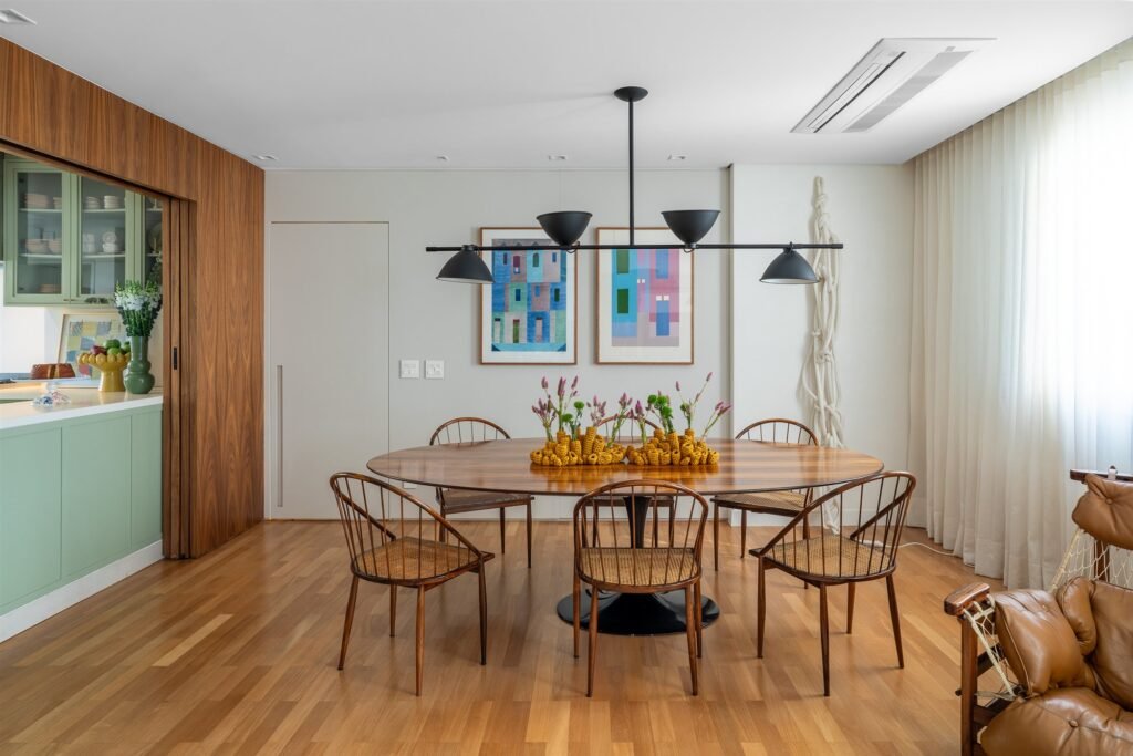 Dining room with sheer curtains behind the table