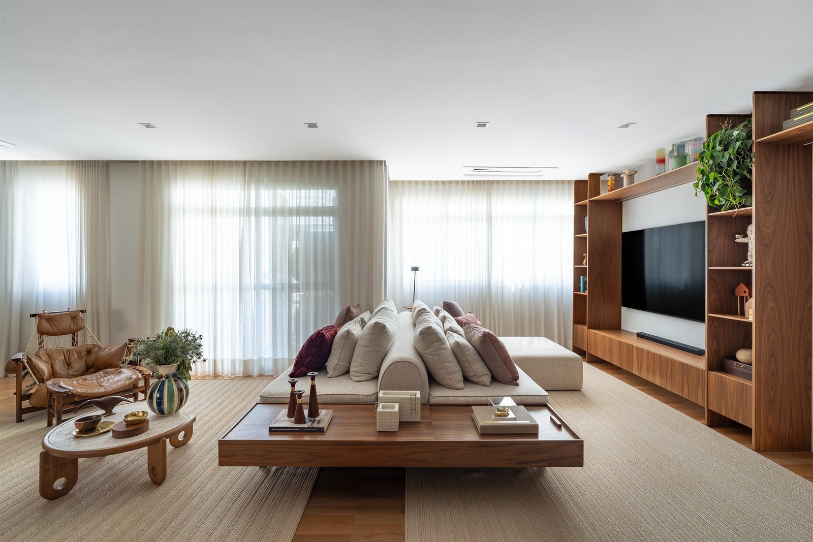 Floor-to-ceiling sheer curtains in a living room