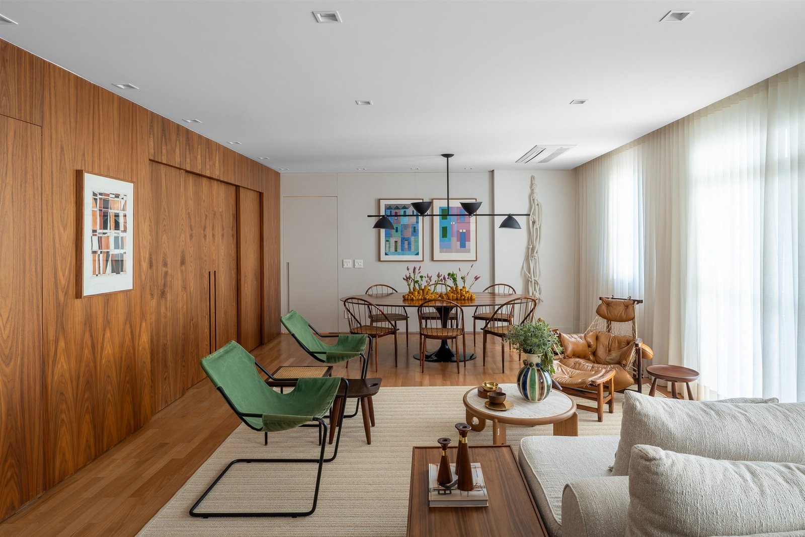 Sheer curtains in a living room with wood paneling