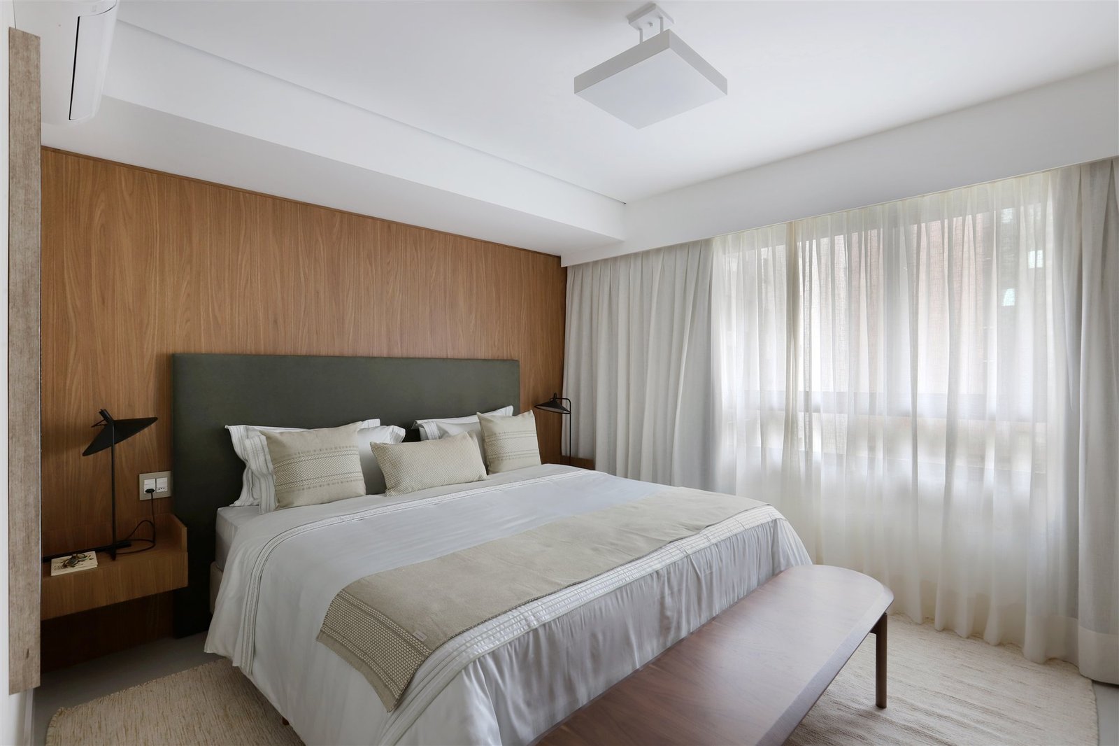 Sheer curtains on a large bedroom window